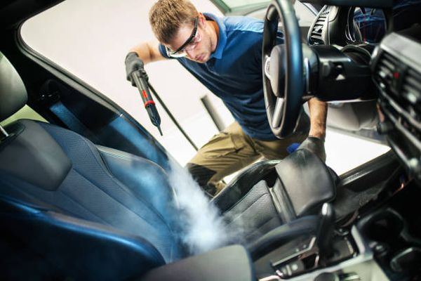 Steam cleaning the interior of a car